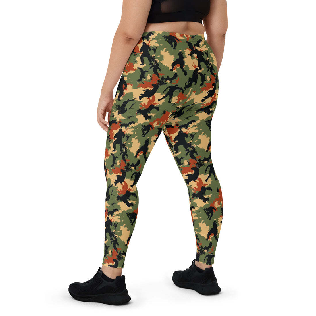 Women wearing Halloween-themed camo leggings in vibrant fall colors