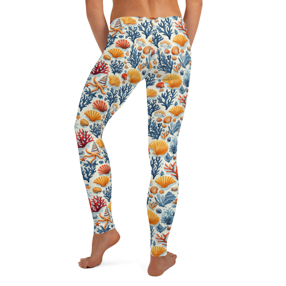 Ocean coral and seashell patterned leggings showcasing blue, red, and orange marine motifs, perfect for winter fashion.