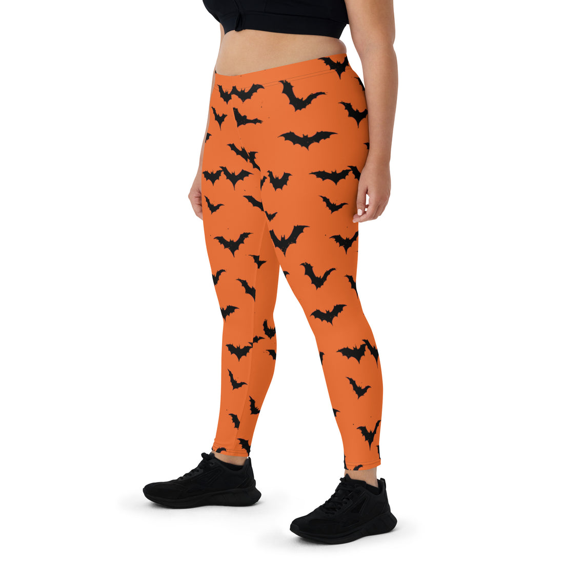 Orange leggings with black bats for women, perfect for Halloween fashion.