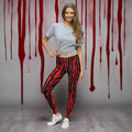 Blood-spattered leggings in red and black, stylish women's fashion, perfect for Halloween.