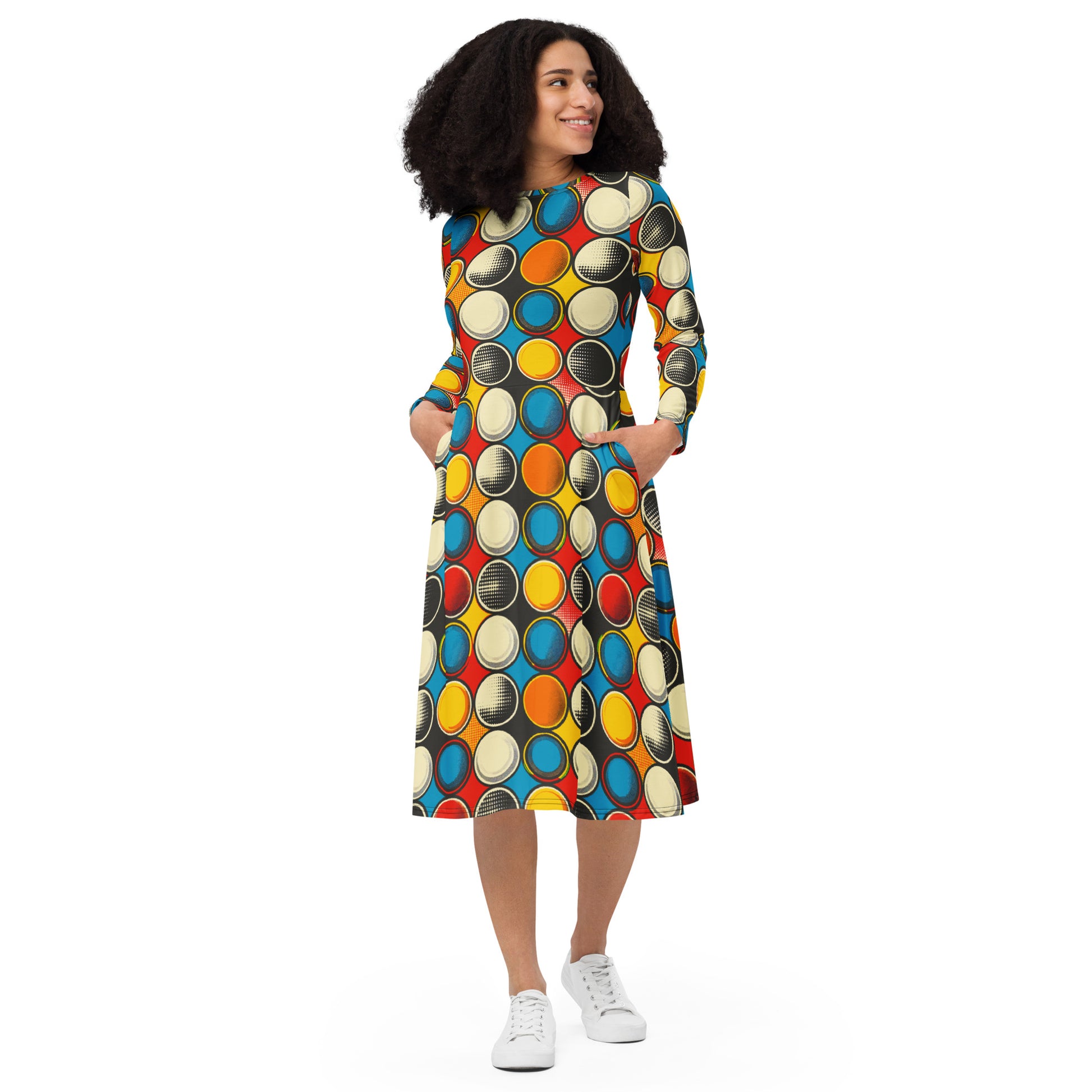 Colorful long sleeve midi dress with polka dot pattern and pockets.