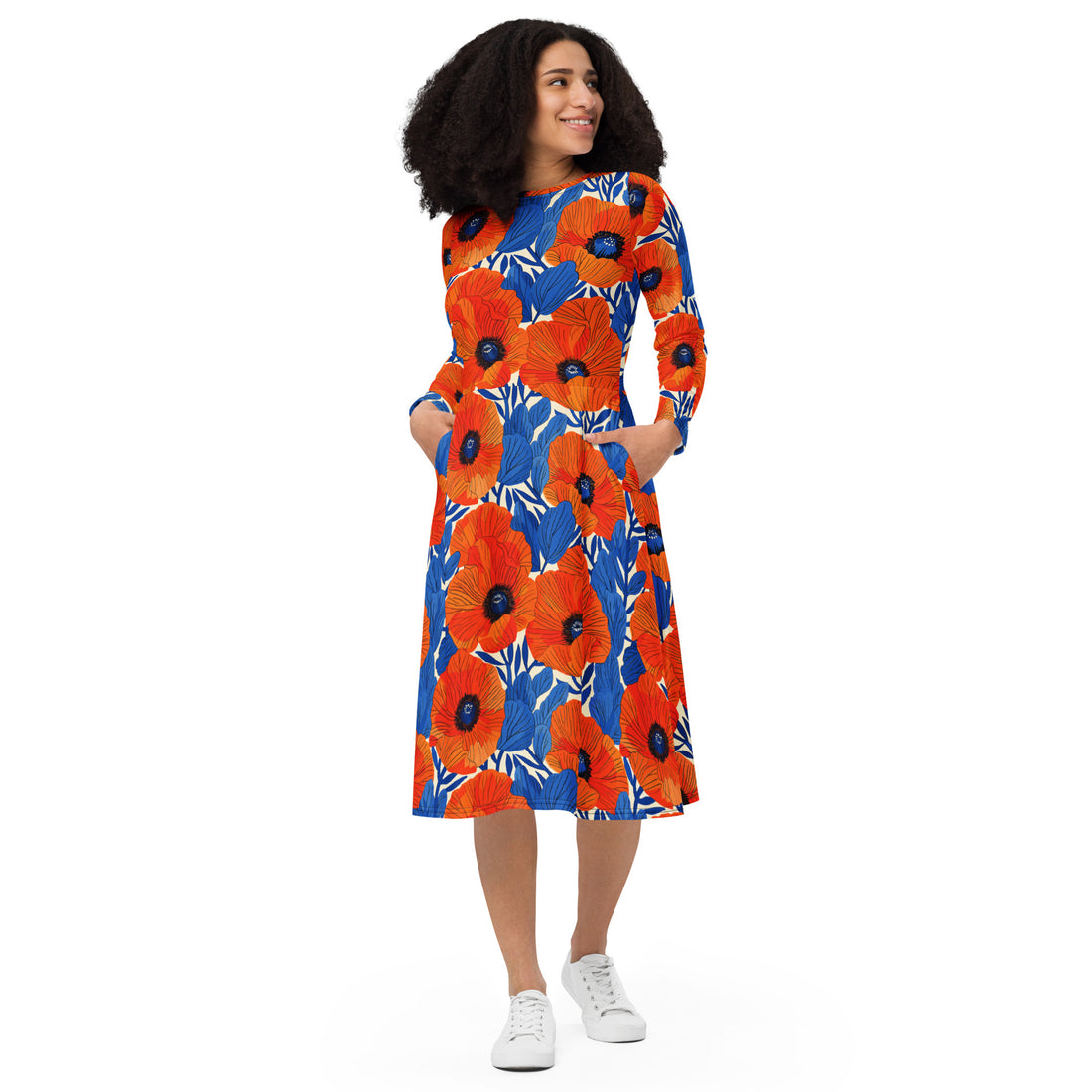 Vibrant floral midi dress featuring orange poppies against a blue background, long sleeves, fitted waist, and side pockets.