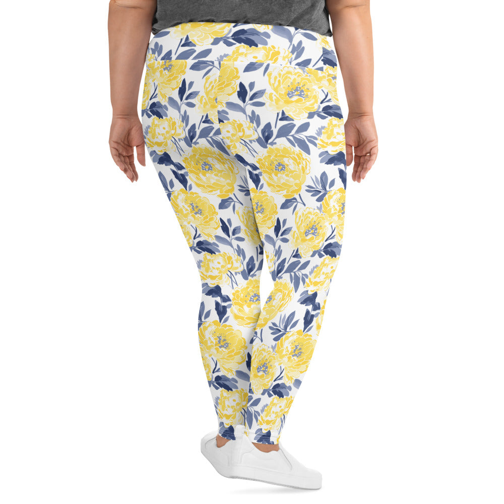 Plus size leggings featuring vibrant yellow peony floral design with a white background, showcasing comfort and style.