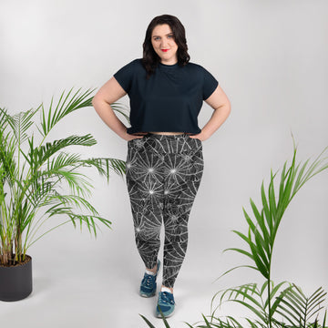 Plus size leggings with a spooky spider web design in black and white.