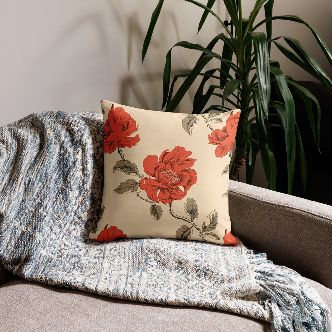 Elegant pillow with vibrant red rose floral design on a cream background, enhancing holiday home decor with cozy vibes.