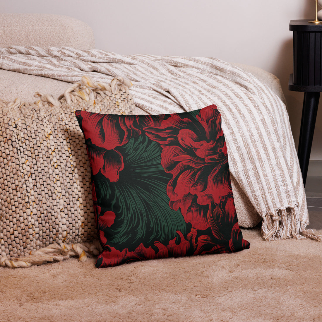 Luxurious floral premium throw pillow with rich red and green design on a soft background.