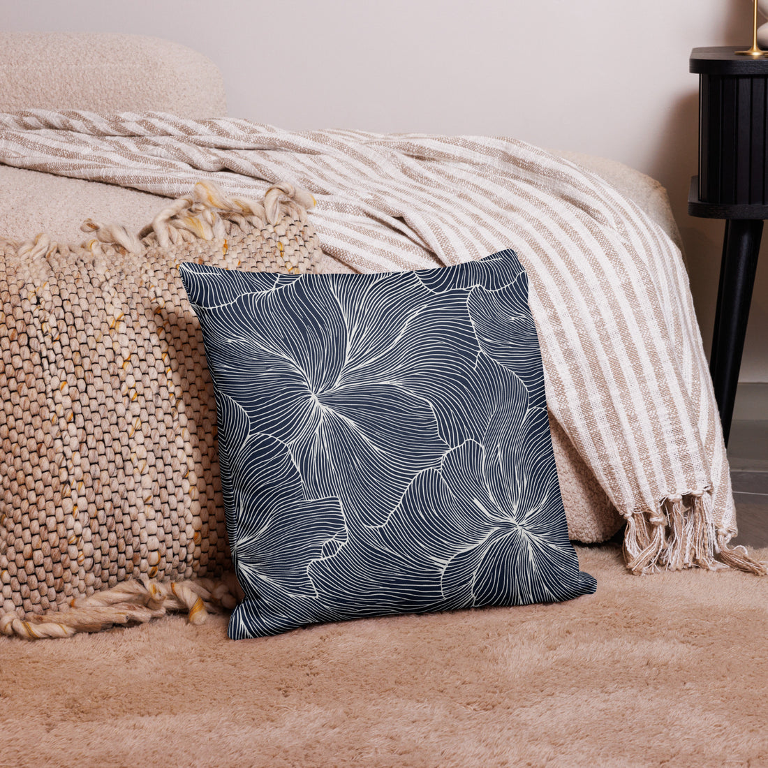 Luxury floral design pillow with a navy background and floral pattern.