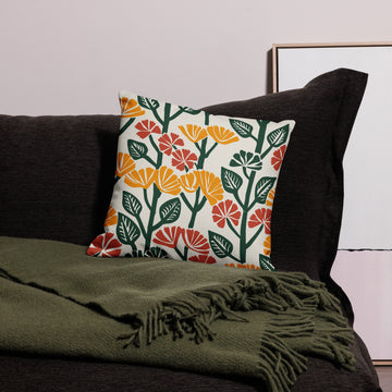 Autumn-themed pillow with vibrant floral design in mustard, rust, and emerald hues