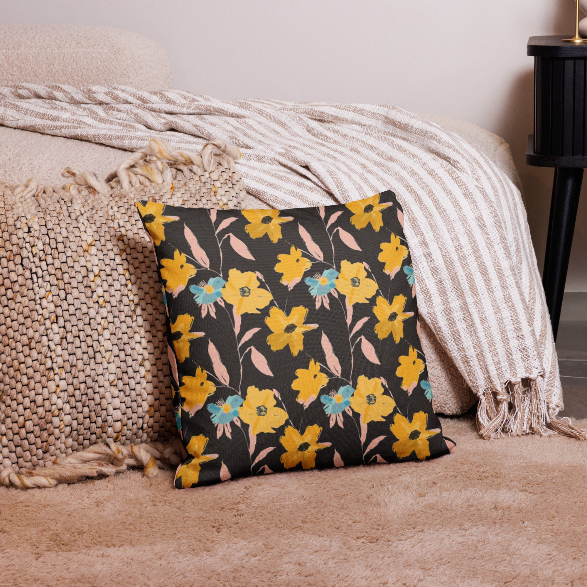 Accent pillow with vibrant yellow and teal floral design on a dark background, perfect for winter home decor.