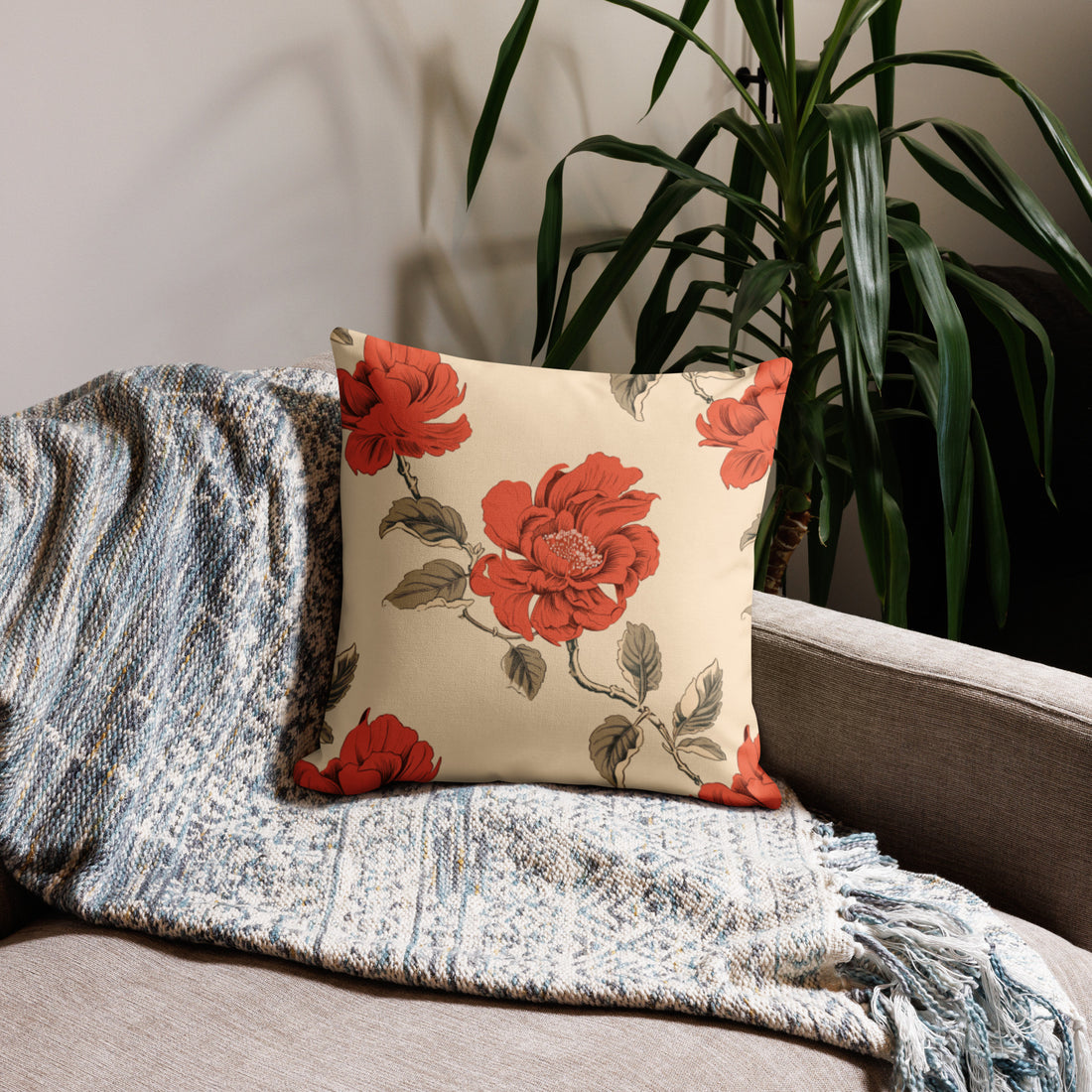 Elegant pillow with vibrant red rose floral design on a cream background, enhancing holiday home decor with cozy vibes.