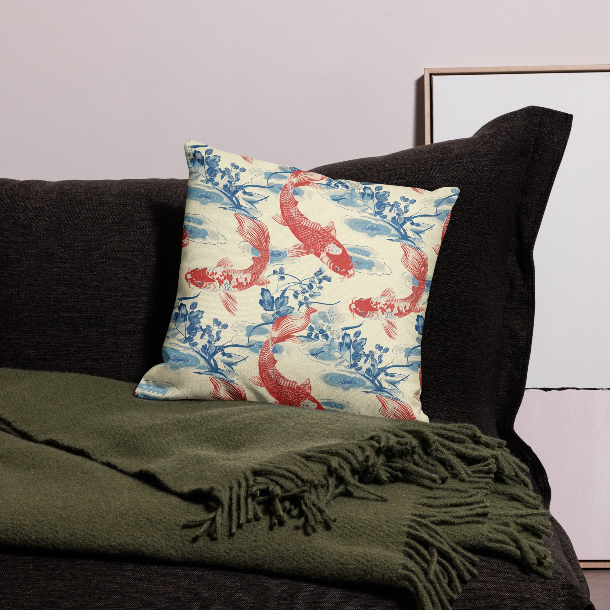 Koi fish pattern knitted pillow cover with red koi and blue floral design on a cream background.