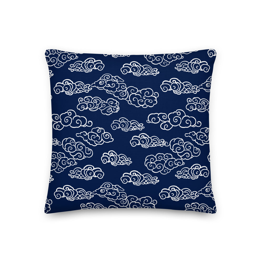 Navy knitted pillow with intricate white cloud pattern, perfect for winter decor.