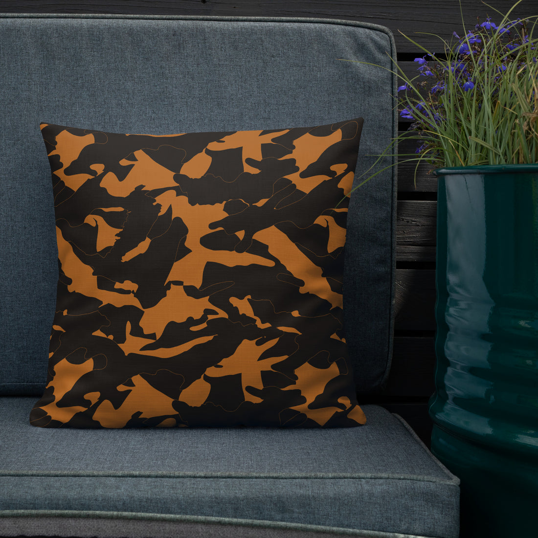 Square pillow with an abstract golden camo design, featuring a hidden zipper, against a neutral background.