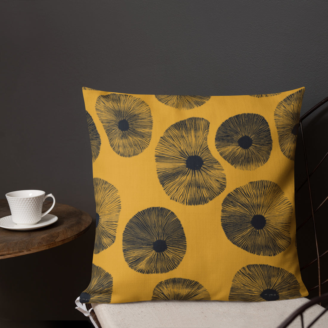 Vibrant floral print premium pillow in mustard with black flowers.