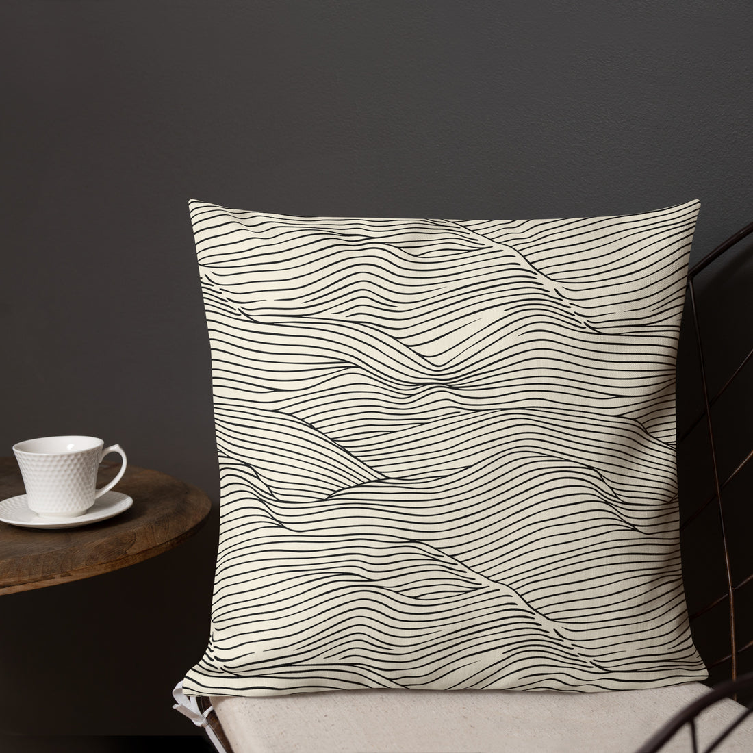 Elegant wave print pillow with a black and white design, perfect for modern decor.