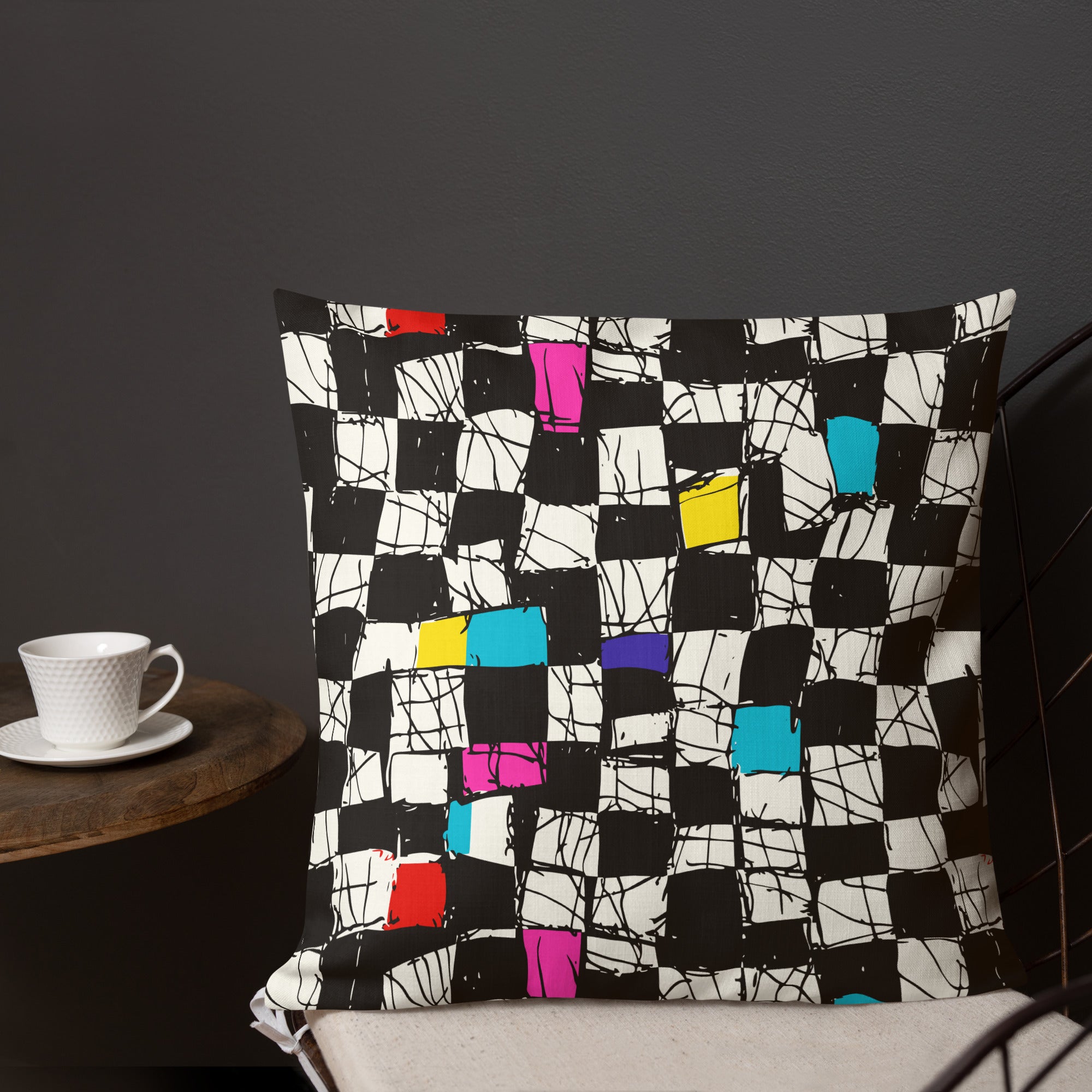 Vibrant Abstract Checkered Pillow with Red, Yellow, Blue, and Purple Squares on Black and White Background