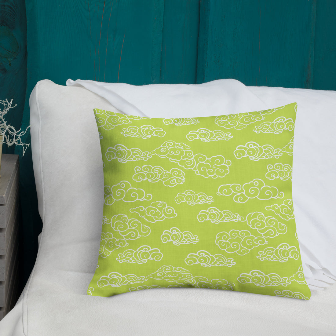 Luminous green cloud pattern pillow on bed