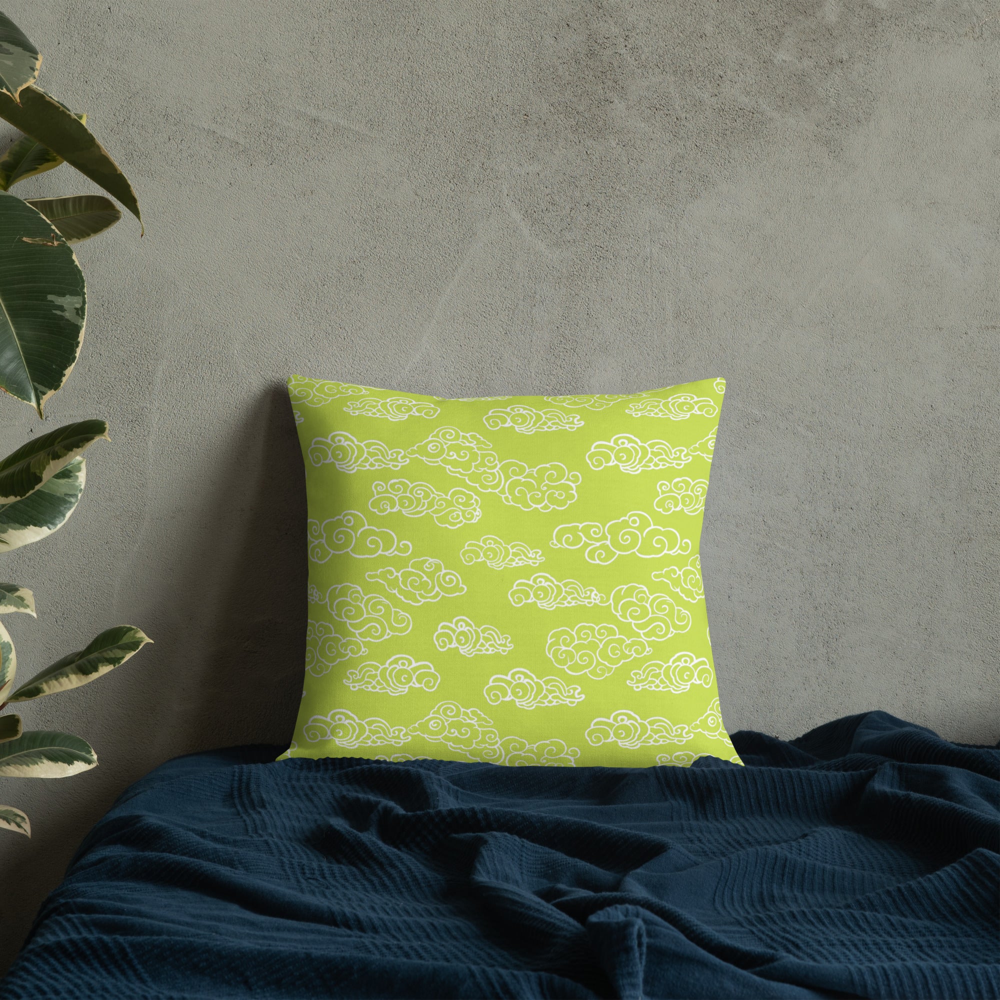 Luminous green cloud pattern pillow on bed