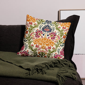 Vibrant floral premium pillow featuring colorful botanical designs on a cozy sofa.