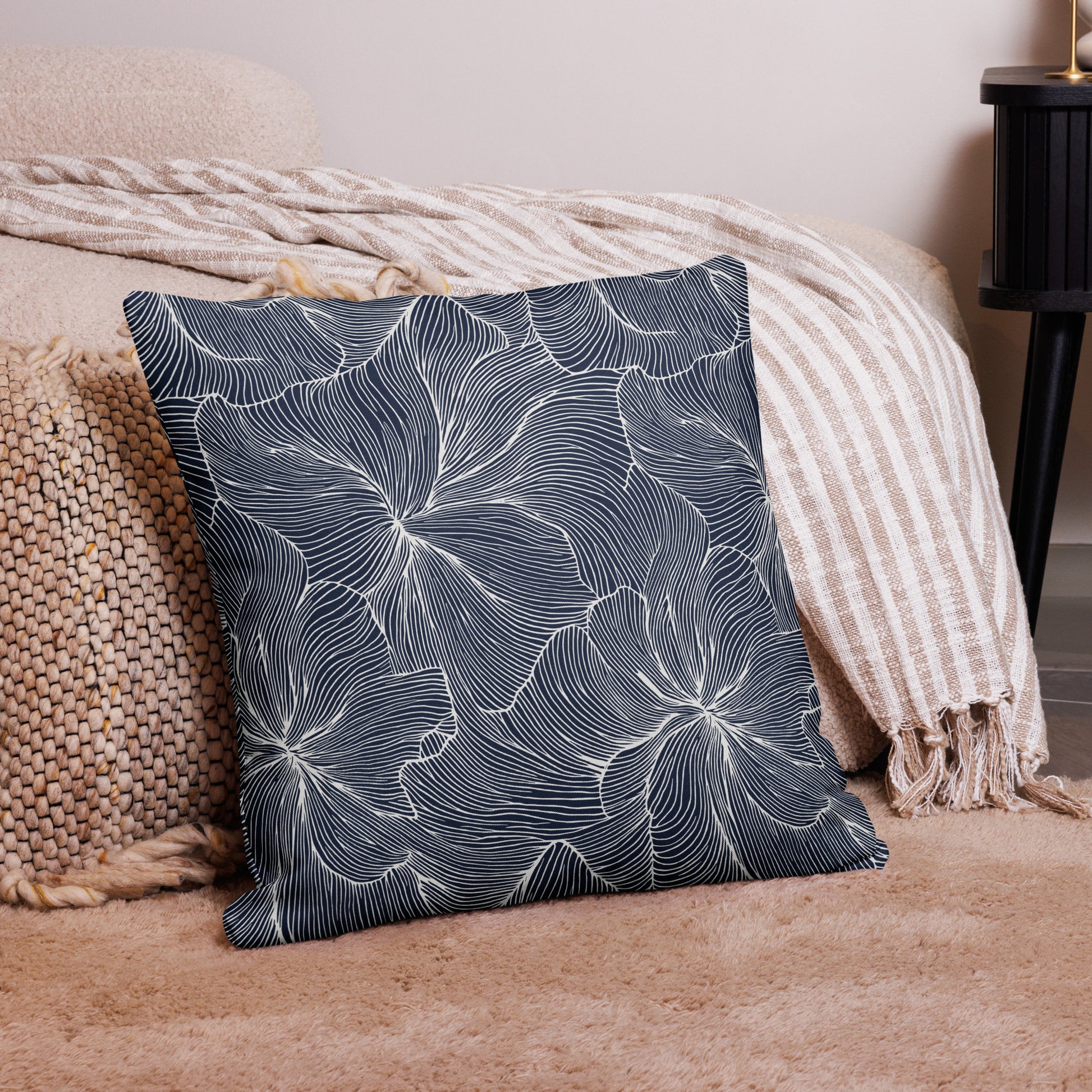 Luxury floral design pillow with a navy background and floral pattern.