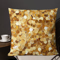 Golden discs decorative pillow with a vibrant gold and neutral design on a cozy setting.