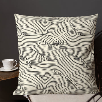 Elegant wave print pillow with a black and white design, perfect for modern decor.