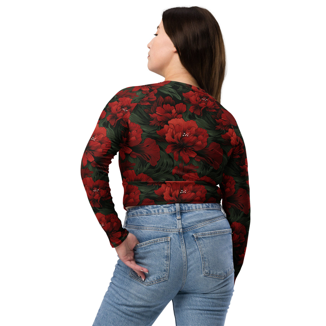 Eco-friendly floral long-sleeve crop top with vibrant red flowers on a black background, model wearing jeans.