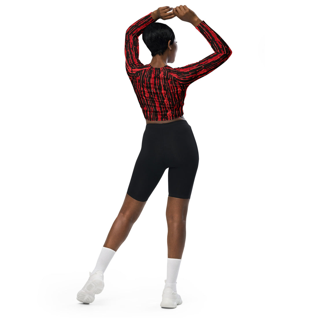 Women's recycled long-sleeve crop top in red and black blood-splatter design.