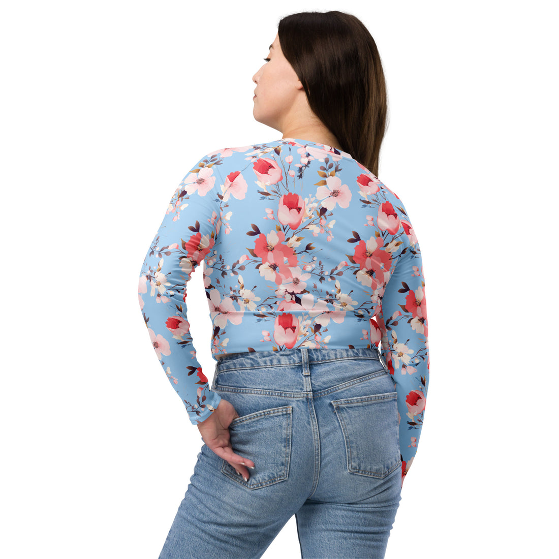 Vibrant floral crop top featuring pink and red blossoms on a blue background, long sleeves, perfect for winter fashion.