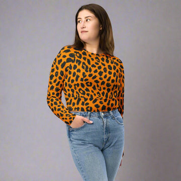 Eco-friendly leopard print long-sleeve crop top in orange and black design.