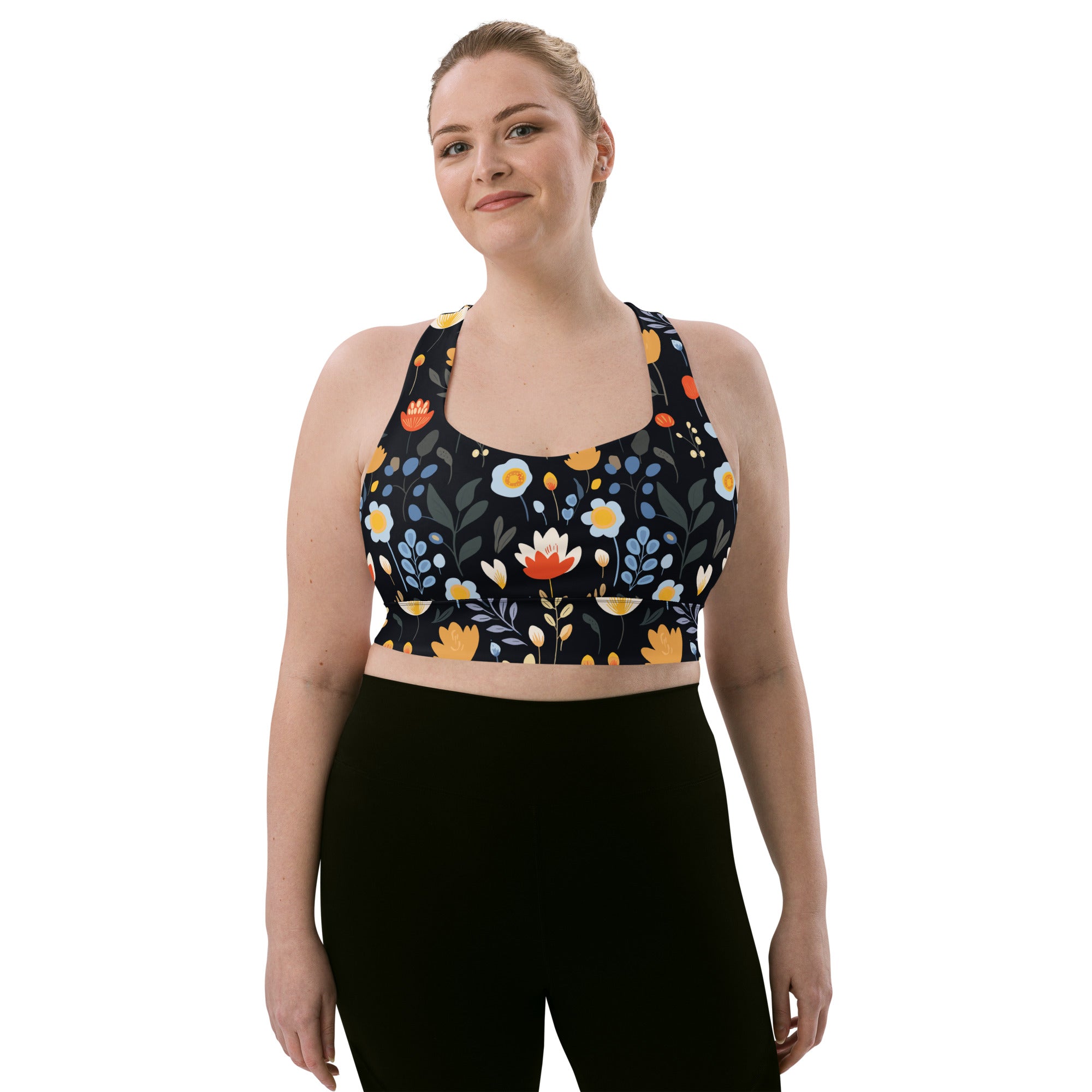 Eco-friendly sports bra with vibrant red, yellow, and blue floral design