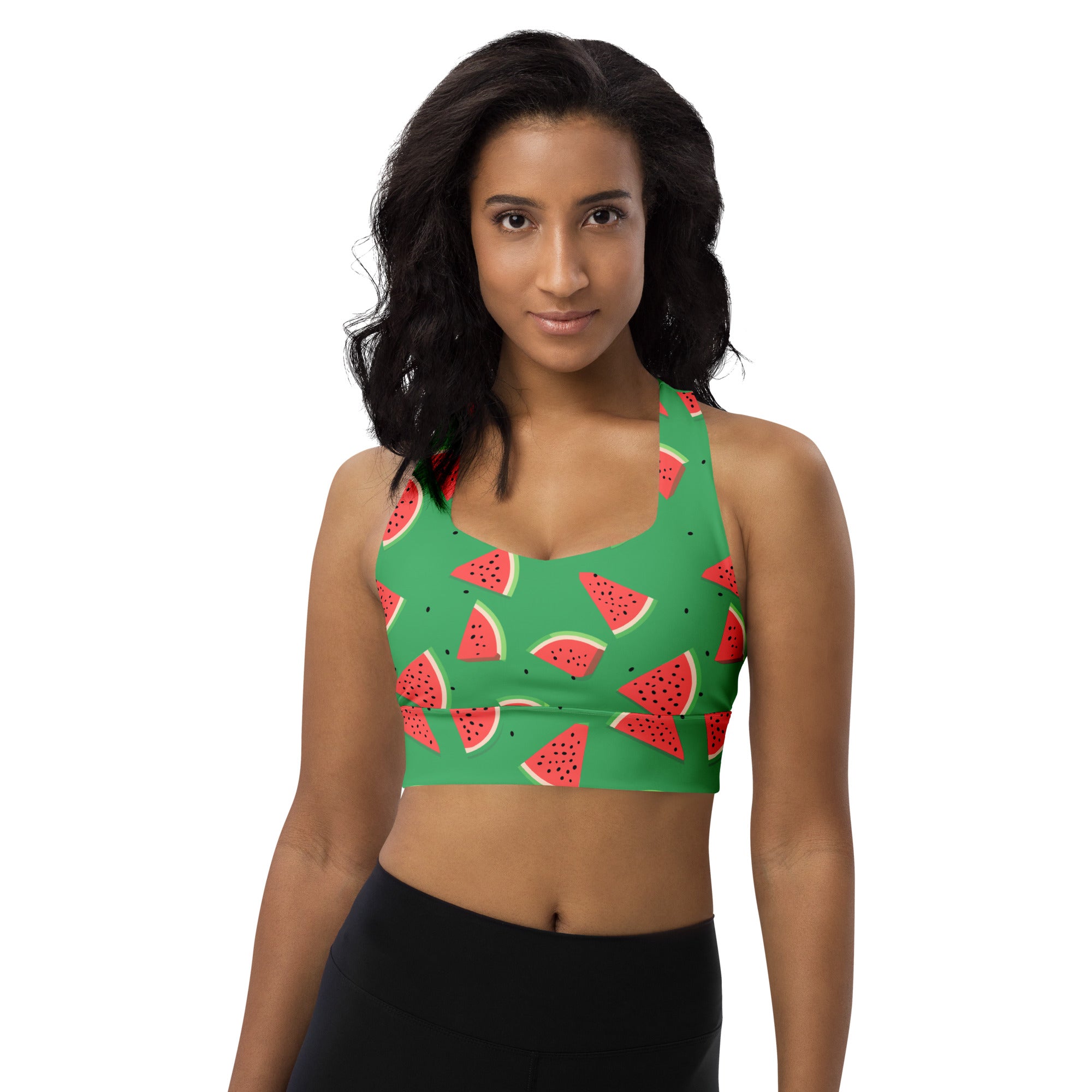 Woman wearing a vibrant sports bra with a colorful watermelon print, eco-friendly recycled materials, ideal for workouts and casual wear.