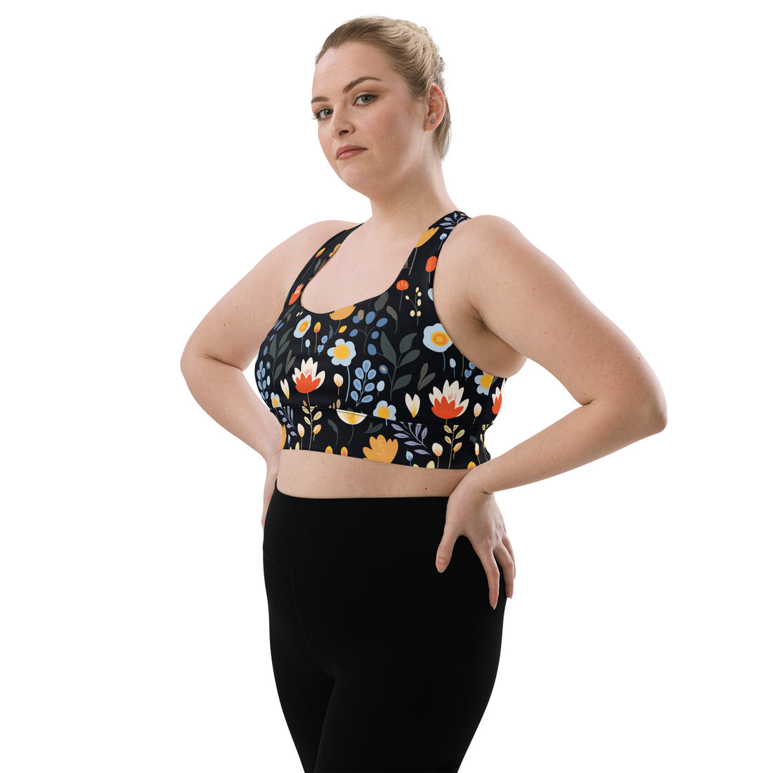 Eco-friendly sports bra with vibrant red, yellow, and blue floral design