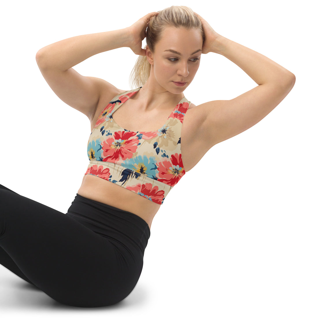 Eco-friendly sports bra with vibrant floral design featuring red, beige, and blue hues, perfect for winter and holiday fashion.