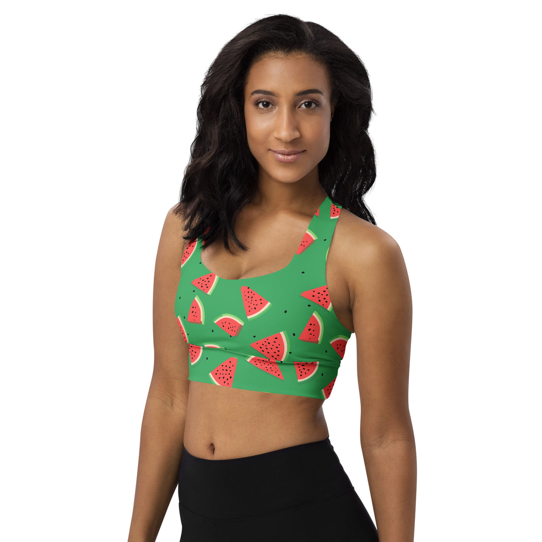 Woman wearing a vibrant sports bra with a colorful watermelon print, eco-friendly recycled materials, ideal for workouts and casual wear.