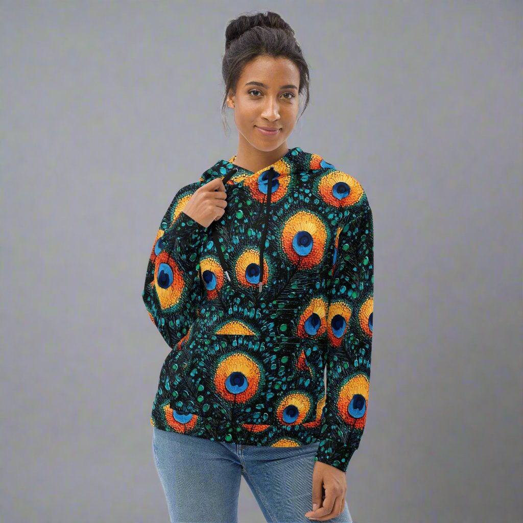 Vibrant peacock print unisex hoodie on a model, showcasing colorful patterns against a black background.