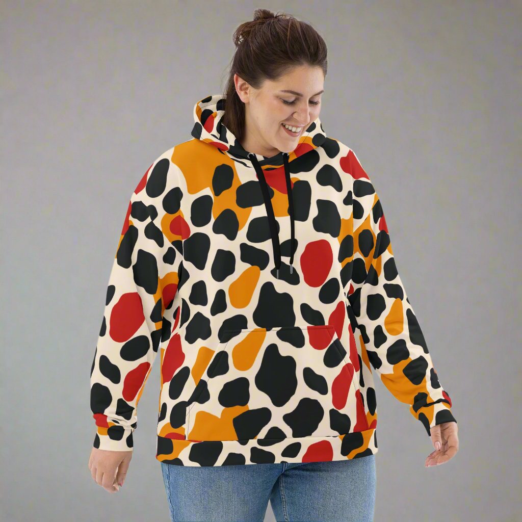 Vibrant animal print unisex hoodie featuring colorful spots on a cream background.