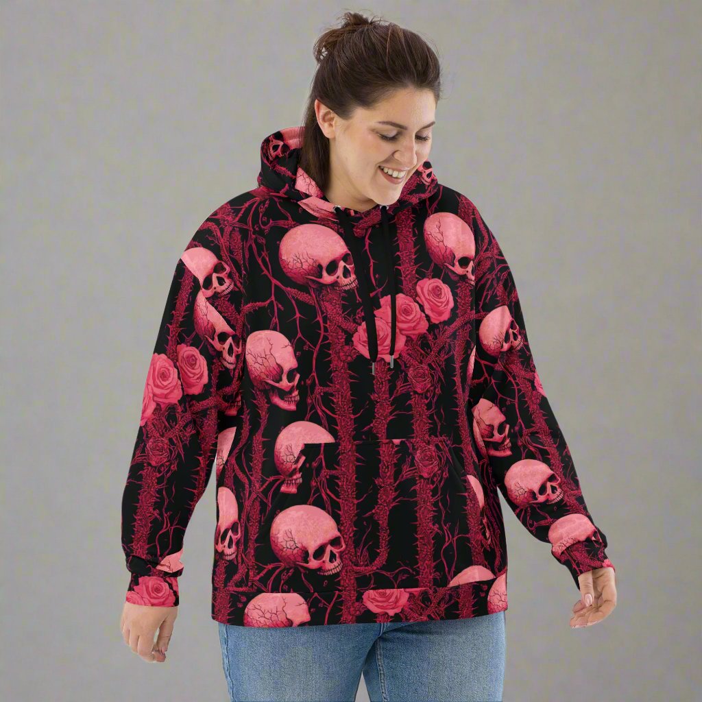 Gothic floral skull hoodie featuring pink skulls and roses on a black background, perfect for Halloween.