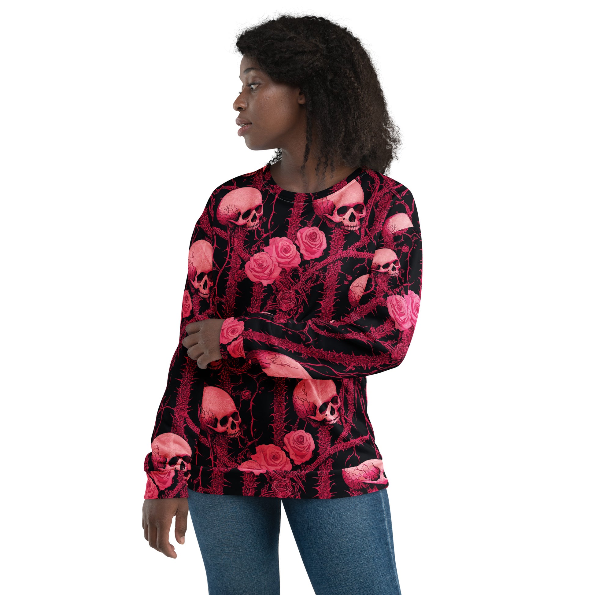 Pink skulls and roses design on black sweatshirt for Halloween.