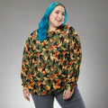 Bigfoot camo sweatshirt featuring silhouette design in autumn colors of green, orange, and yellow.