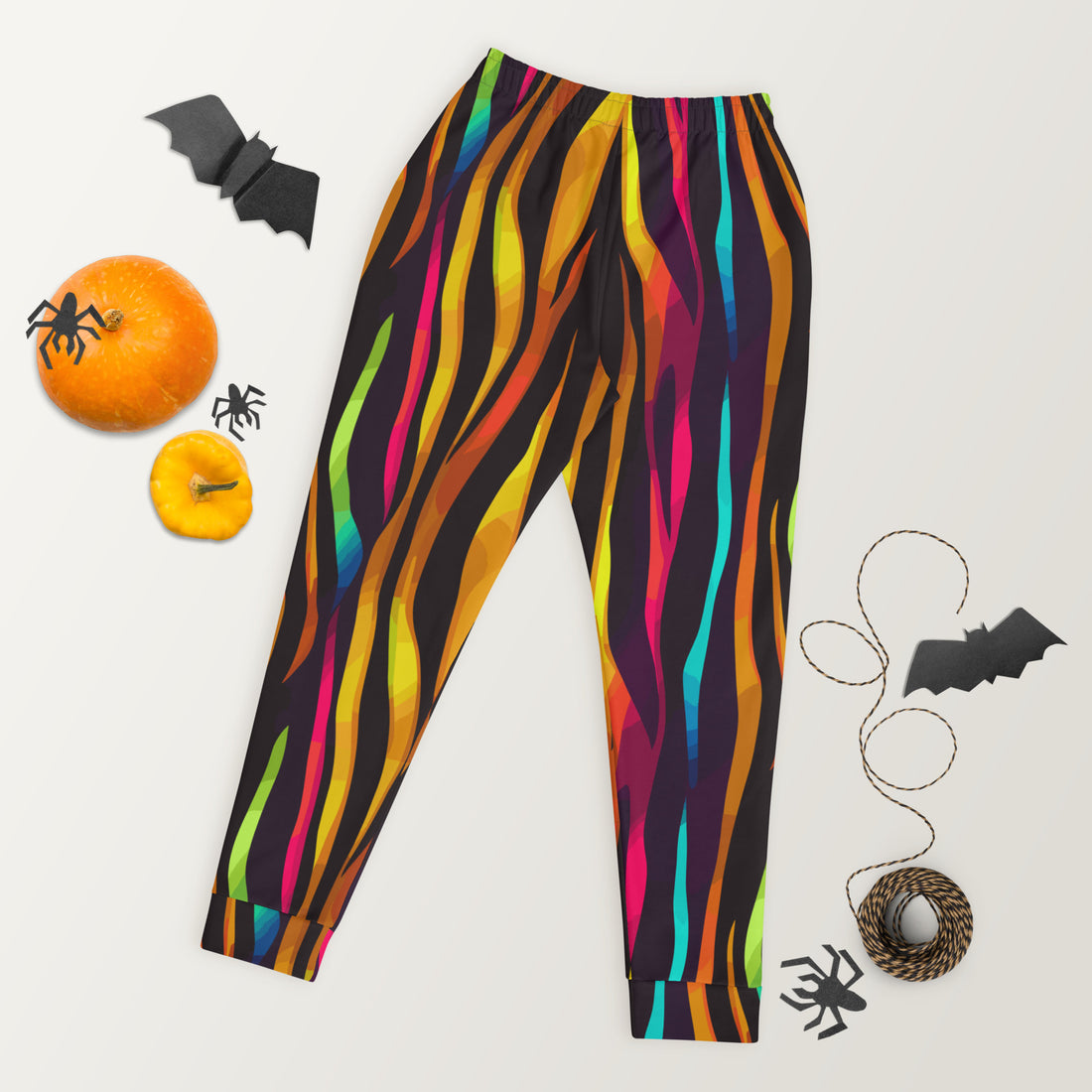 Vibrant striped women's joggers in a colorful design with a slim fit being worn outdoors.