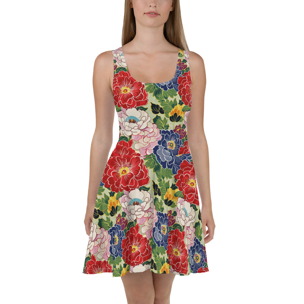 Sleeveless skater dress with a colorful floral print featuring red, pink, and blue flowers against a green background.