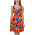 Vibrant floral skater dress featuring orange and blue flowers on a white background, perfect for summer occasions.