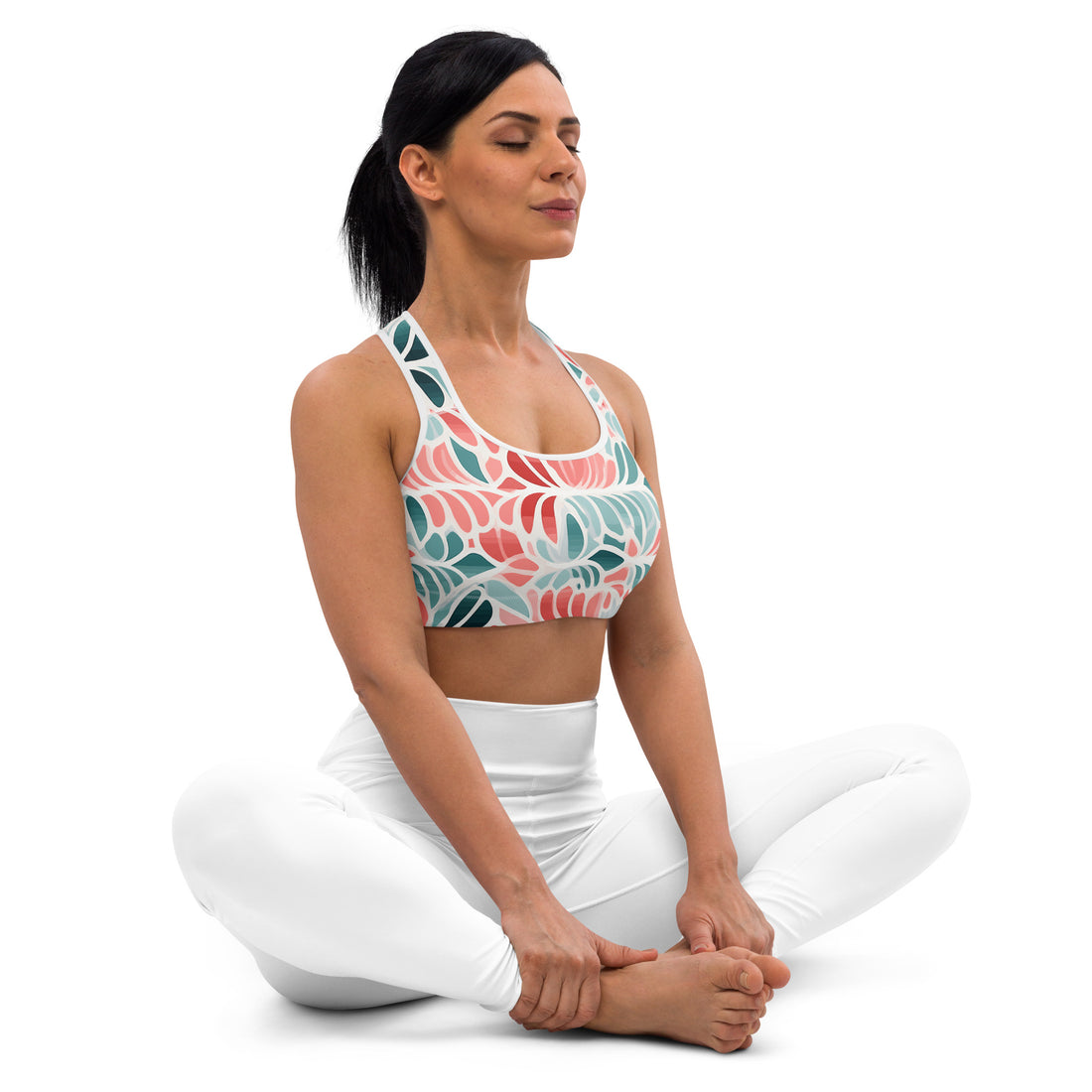 Floral-print sports bra on a woman in a yoga pose, showcasing comfort and style