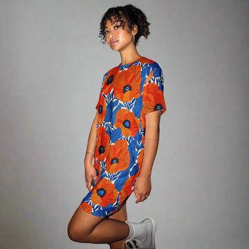 Vibrant floral oversized t-shirt dress featuring orange and blue poppy flowers on a model.