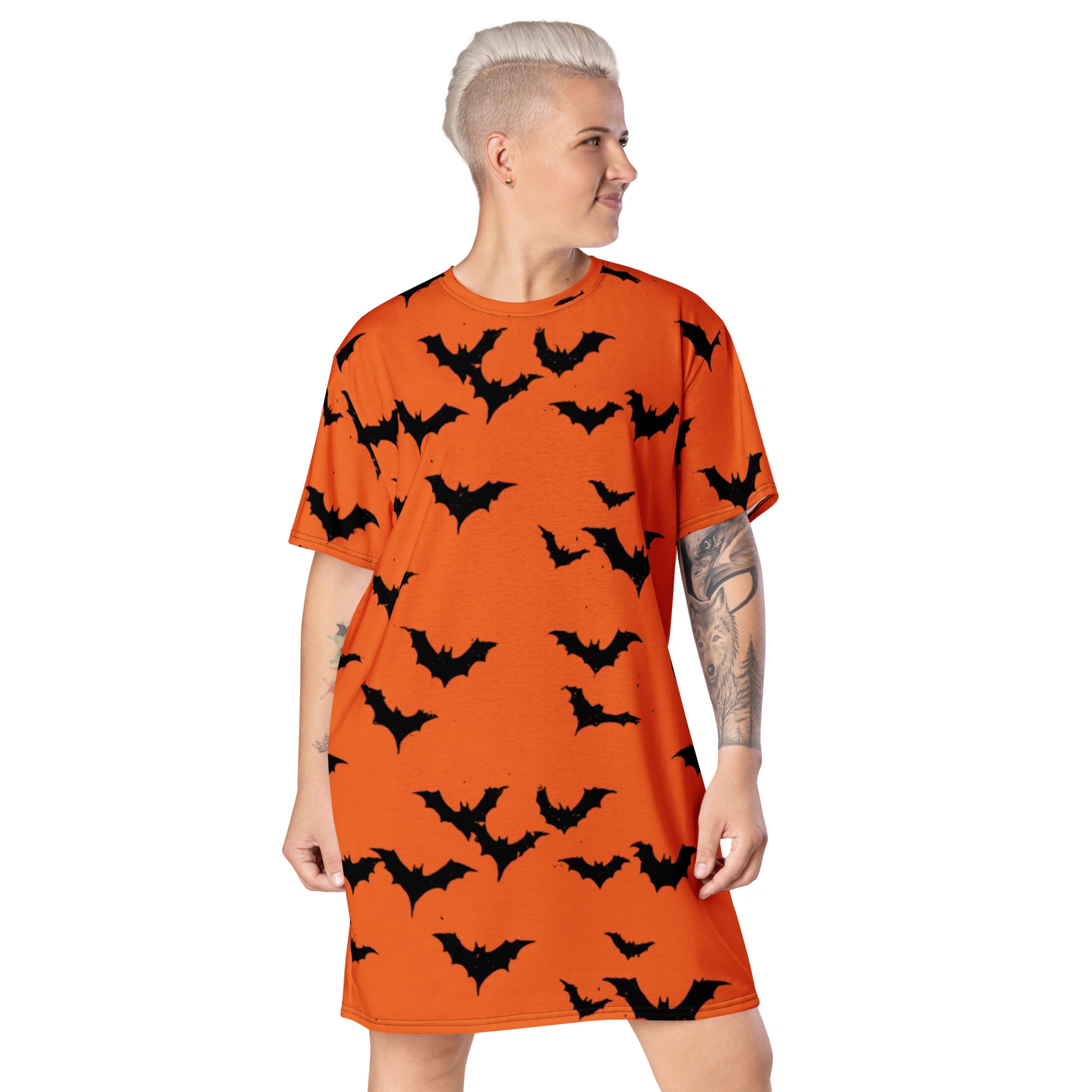 Women's oversized Halloween bat print t-shirt dress in orange with black bats.