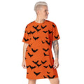 Women's oversized Halloween bat print t-shirt dress in orange with black bats.