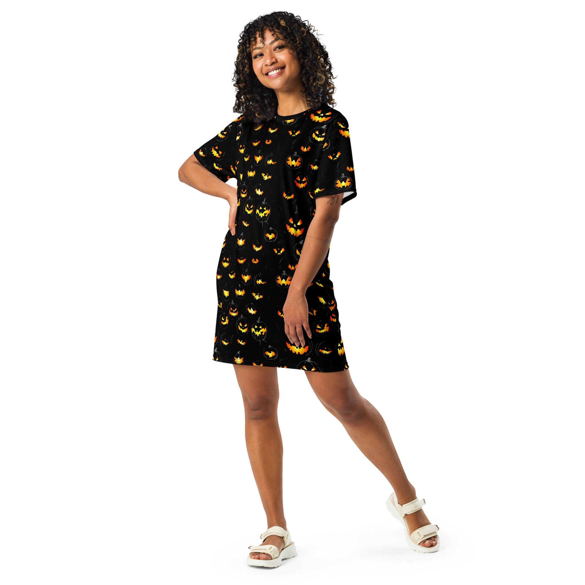 Spooky Chic Halloween T-Shirt Dress featuring vibrant pumpkin print on black fabric