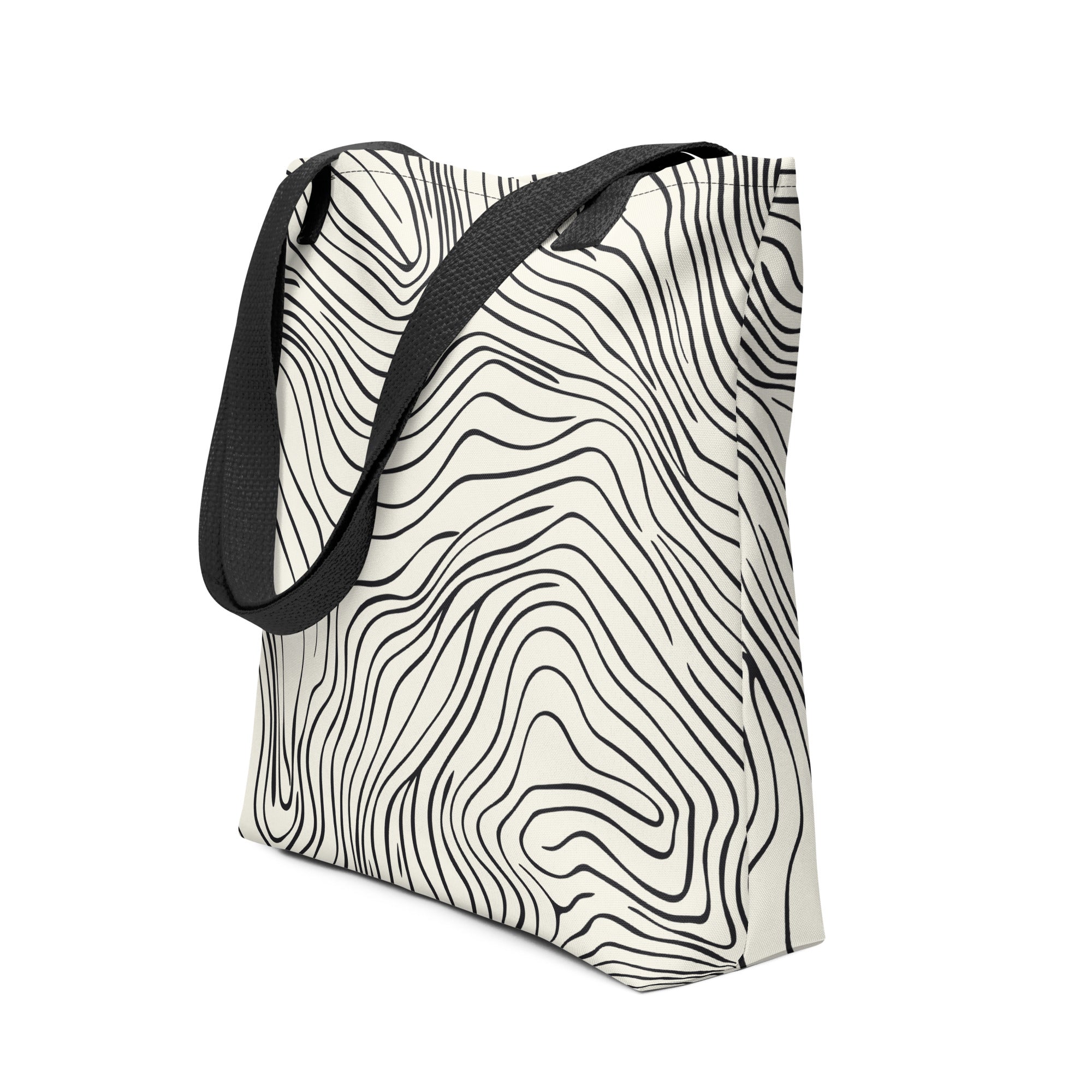 A stylish tote bag with a black and white wave pattern.