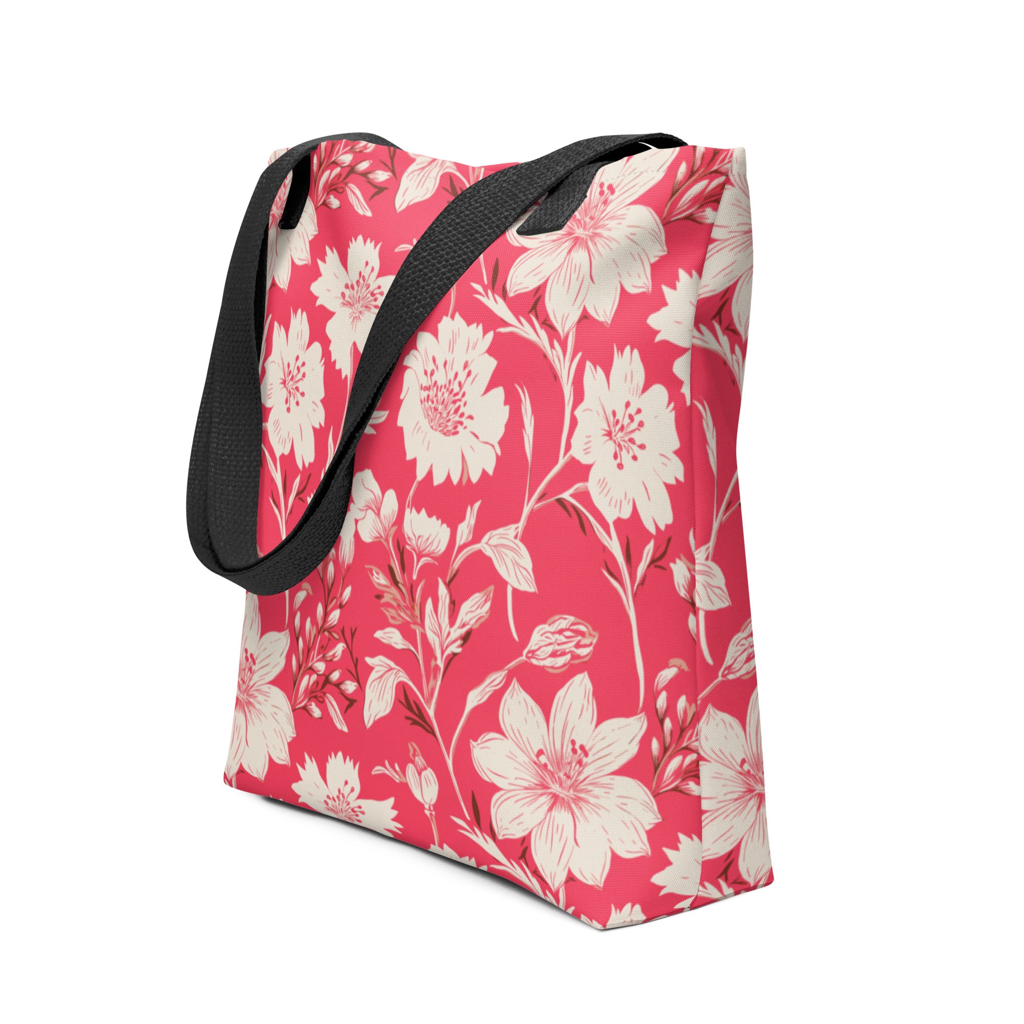 Floral print tote bag with pink background and black handles.